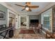 Florida room with slate floors connects to a bedroom and features a ceiling fan at 2048 Douglas Ave, Dunedin, FL 34698