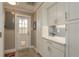 Bright mud room with white cabinets, light countertop, and easy access to the outside at 2048 Douglas Ave, Dunedin, FL 34698