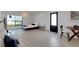 Well-lit bedroom with a minimalist aesthetic, featuring light wood floors and neutral walls at 2084 Massachusetts Ne Ave, St Petersburg, FL 33703