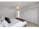 Clean bedroom with closet featuring a decorative light and terrazzo floors at 2084 Massachusetts Ne Ave, St Petersburg, FL 33703