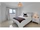 Cozy bedroom with ample natural light and bedside tables with matching lamps at 2084 Massachusetts Ne Ave, St Petersburg, FL 33703