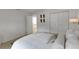 Simple bedroom with closet and view of living room through an open door at 2084 Massachusetts Ne Ave, St Petersburg, FL 33703
