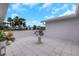 Charming courtyard featuring tile floors, lovely potted plants, and a white table at 2084 Massachusetts Ne Ave, St Petersburg, FL 33703