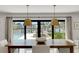 Dining room with water views, stylish light fixtures, and modern furniture at 2084 Massachusetts Ne Ave, St Petersburg, FL 33703