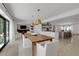 Bright open dining room flows seamlessly to living room and kitchen areas at 2084 Massachusetts Ne Ave, St Petersburg, FL 33703