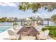 Outdoor dining and entertaining by the waterfront with boat dock and stunning water views at 2084 Massachusetts Ne Ave, St Petersburg, FL 33703