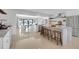 Spacious kitchen featuring an island with seating and bar area, modern appliances, and open layout at 2084 Massachusetts Ne Ave, St Petersburg, FL 33703