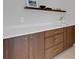 Stylish kitchenette featuring sleek cabinetry, quartz countertops, and floating shelf at 2084 Massachusetts Ne Ave, St Petersburg, FL 33703