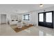 Cozy living room with plush white seating, large windows, and decorative accents at 2084 Massachusetts Ne Ave, St Petersburg, FL 33703