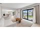 Bright living room with sliding doors to backyard patio and canal view at 2084 Massachusetts Ne Ave, St Petersburg, FL 33703