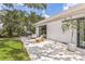 Backyard patio with a lounge seating area, grill and landscaping on a sunny day outside the home at 2084 Massachusetts Ne Ave, St Petersburg, FL 33703