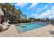 Inviting backyard with a private pool, jacuzzi, patio, and lush tropical landscaping at 2084 Massachusetts Ne Ave, St Petersburg, FL 33703