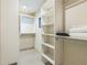 Spacious walk-in closet featuring built-in shelving and ample storage space at 2084 Massachusetts Ne Ave, St Petersburg, FL 33703