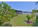 Private backyard includes an enclosed lanai, plus lush grass, manicured landscaping, and plenty of space at 214 Lookout Dr, Apollo Beach, FL 33572