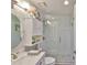 Bathroom featuring a glass enclosed shower, white vanity, and tile flooring at 214 Lookout Dr, Apollo Beach, FL 33572