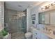 Bathroom featuring glass enclosed shower, white vanity, and neutral decor at 214 Lookout Dr, Apollo Beach, FL 33572