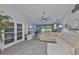 Spacious living room with a comfortable sectional sofa, elegant decor, and lots of natural light at 214 Lookout Dr, Apollo Beach, FL 33572