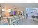 Open-concept living room with modern furnishings, a cozy sofa, and a seamless connection to the kitchen at 214 Lookout Dr, Apollo Beach, FL 33572