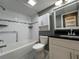 Bathroom with updated vanity, subway tile in shower, and tiled floors at 2295 Mexican Way # 41, Clearwater, FL 33763