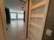 View of the bedrooms showcasing the tile floors and plantation shutters at 2295 Mexican Way # 41, Clearwater, FL 33763