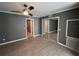 Bedroom with tiled floor, mirrored closet doors, and gray walls at 2295 Mexican Way # 41, Clearwater, FL 33763