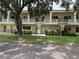 Charming condominium featuring classic architecture, private balconies, and landscaped grounds at 2295 Mexican Way # 41, Clearwater, FL 33763