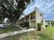 Condominium building featuring sidewalks and allocated resident parking at 2295 Mexican Way # 41, Clearwater, FL 33763