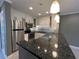 Updated kitchen featuring granite counters, stainless steel appliances, and modern lighting at 2295 Mexican Way # 41, Clearwater, FL 33763