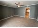 Spacious living room with gray walls, tiled flooring, and ceiling fan at 2295 Mexican Way # 41, Clearwater, FL 33763