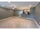 Spacious living room featuring tile flooring, ceiling fan, and open concept kitchen at 2295 Mexican Way # 41, Clearwater, FL 33763