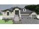 Elegant single-Gathering home boasts stone accents, two-car garage and lush landscaping at 24060 Peppercorn Rd, Punta Gorda, FL 33955