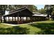 Large outdoor pavilion features picnic tables, a spacious shelter, and grassy surroundings at 24060 Peppercorn Rd, Punta Gorda, FL 33955