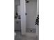 A sleek bathroom with a tiled shower, gray vanity, and modern design elements at 2551 12Th St, Englewood, FL 34224