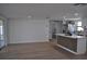 Open concept living and kitchen space, featuring stainless steel appliances, granite countertops and a waterfall island at 2551 12Th St, Englewood, FL 34224