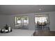 View of a screened patio with a dining table and chairs, accessible via sliding glass doors at 2551 12Th St, Englewood, FL 34224