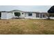 View of the backyard highlighting a shed and enclosed patio, ready for outdoor entertaining at 3035 Coldwell Dr, Holiday, FL 34691
