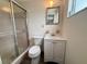 A clean bathroom featuring a shower and vanity with a framed mirror at 3035 Coldwell Dr, Holiday, FL 34691
