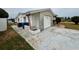 Single-car garage with brick details on a home that features an ample driveway for extra parking at 3035 Coldwell Dr, Holiday, FL 34691