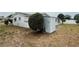 Exterior angle showing shed and ample yard space at 3035 Coldwell Dr, Holiday, FL 34691