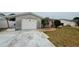 Charming single-story home with a one-car garage and tidy front yard at 3035 Coldwell Dr, Holiday, FL 34691
