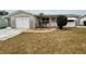 Charming single-story home with a well-maintained front yard and decorative brick pathway at 3035 Coldwell Dr, Holiday, FL 34691