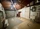 Spacious garage with a workbench, overhead storage, and utility sink at 3035 Coldwell Dr, Holiday, FL 34691