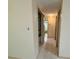 Hallway view showcasing convenient built-in storage and access to other rooms at 3035 Coldwell Dr, Holiday, FL 34691
