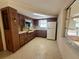 Functional kitchen featuring classic cabinetry and essential appliances, ready for updates at 3035 Coldwell Dr, Holiday, FL 34691