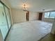 Open-concept living space with sliding glass doors, perfect for modern living at 3035 Coldwell Dr, Holiday, FL 34691