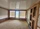 Sunroom with several windows and a glass door to the exterior of the house at 3035 Coldwell Dr, Holiday, FL 34691
