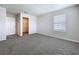 Bedroom with carpet, neutral walls, a window and a walk-in closet at 3063 Marine Grass Dr, Wimauma, FL 33598