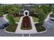 Aerial view of the community clubhouse with lush landscaping and welcoming entrance at 3063 Marine Grass Dr, Wimauma, FL 33598