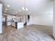 Open concept kitchen with granite countertops and stainless steel appliances at 3063 Marine Grass Dr, Wimauma, FL 33598