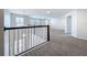 Upstairs loft area with carpet flooring, neutral paint, and lots of natural light at 3063 Marine Grass Dr, Wimauma, FL 33598
